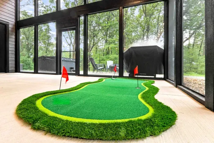 Enjoy a little friendly competition with the indoor putting green amenity, set inside the screened-in porch with peaceful wooded views.