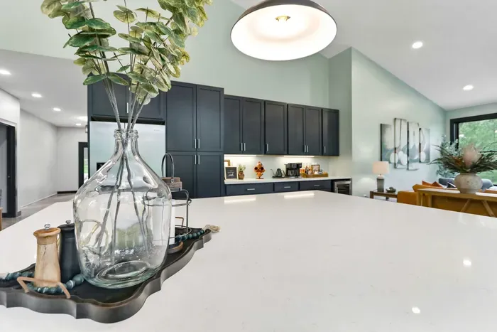 Gather with ease around a sleek oversized island, where polished finishes, thoughtful details, and an open flow set the stage for effortless entertaining.