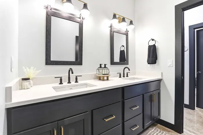 Refresh with ease in a sleek dual-vanity bath, where clean finishes and thoughtful details make shared mornings feel smooth and stylish.