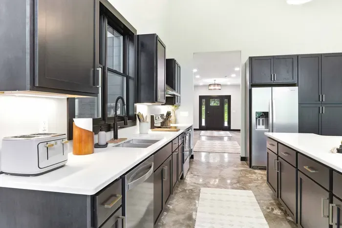 Enjoy a sleek, well-equipped kitchen with bright prep space, modern finishes, and an easy flow that makes every meal feel effortless.