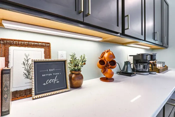 Begin the day with a cozy coffee moment in a thoughtfully styled kitchen nook, complete with warm details and everything ready for an easy morning.