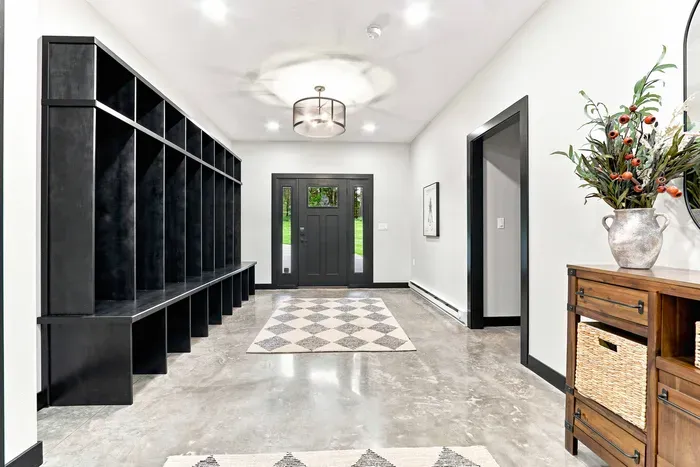 Arrive with ease through the spacious entryway with built-in cubby storage for coats, shoes, and everyday essentials.