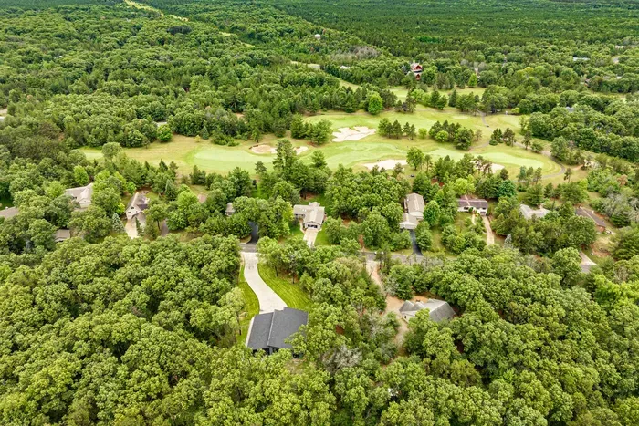 Tucked among the trees, this peaceful retreat offers the perfect blend of privacy and open space.