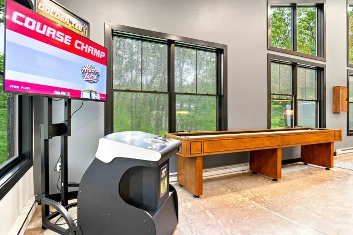 Challenge your crew to Golden Tee golf or a round of shuffleboard in this cozy game space.