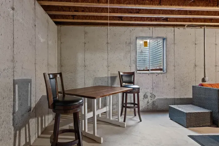 A comfy tables and chairs perfect for unwinding, reading, or enjoying a cozy moment of relaxation.