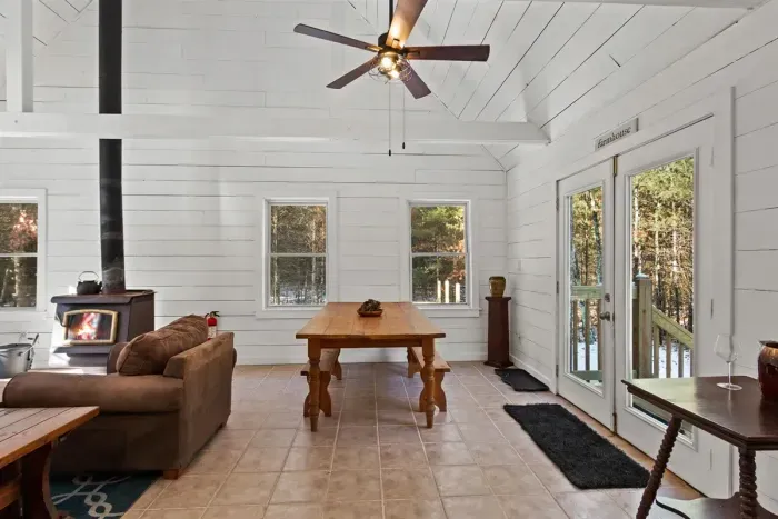 A cozy living room centered around a warm fireplace, perfect for relaxing evenings and creating a welcoming atmosphere.