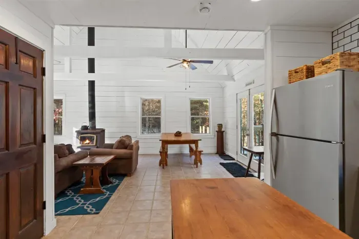 A cozy living room centered around a warm fireplace, perfect for relaxing evenings and creating a welcoming atmosphere.