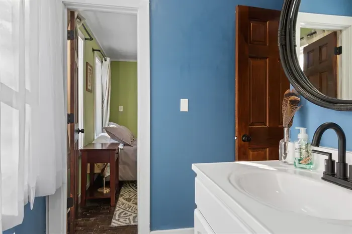 A fresh and vibrant bathroom with crisp white and soothing blue walls, creating a clean and relaxing atmosphere.