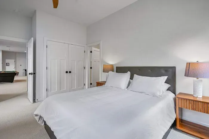 Minimalist bedroom w/ soft light and an uncluttered feel