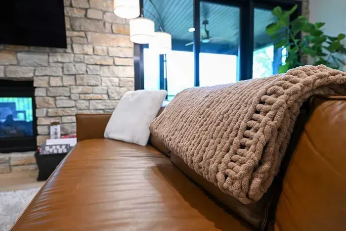 Textured throw and soft layers add warmth to the bedroom