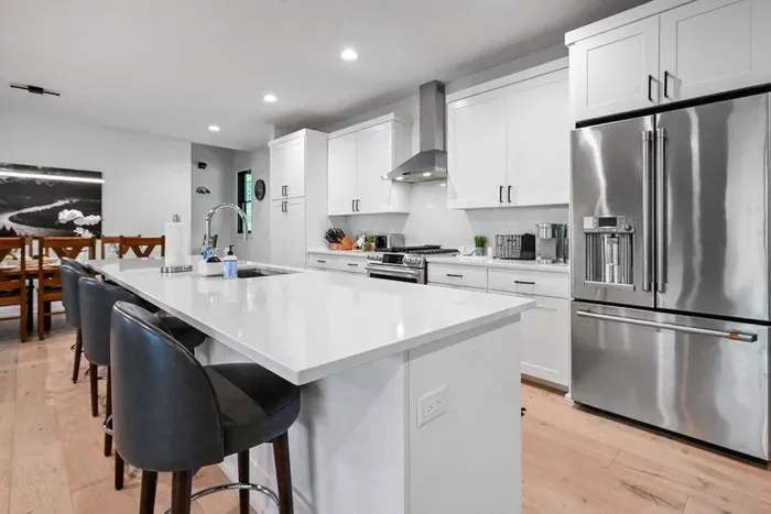 Spacious kitchen counters ready for prep, serving, or casual dining