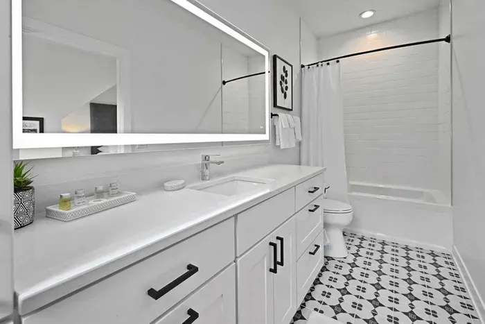 Modern bathroom w/ sleek finishes and a fresh, polished look
