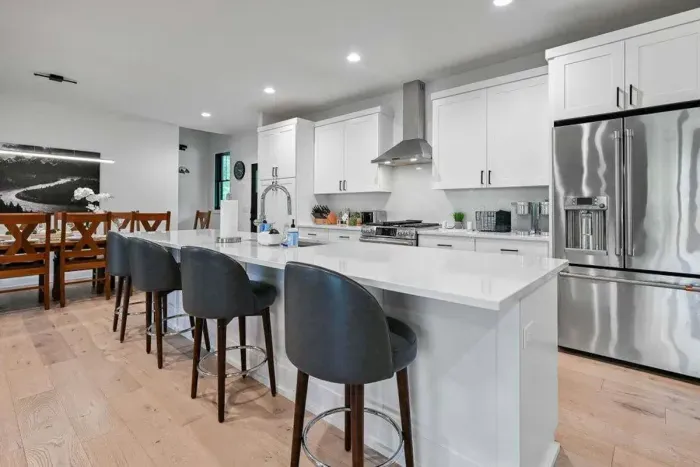 Sleek kitchen island w/ seating, ideal for casual bites and conversation