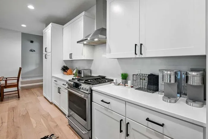 Wide kitchen counters offer plenty of room for prepping, plating, and gathering