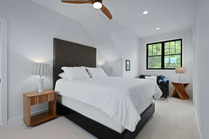Calm bedroom w/ crisp linens and a clean, restful look