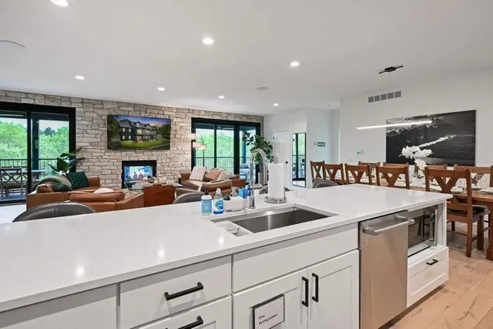 Expansive island anchors the kitchen, ideal for meals and conversation