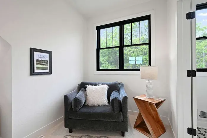 Cozy sleeping space framed by natural light and clean finishes