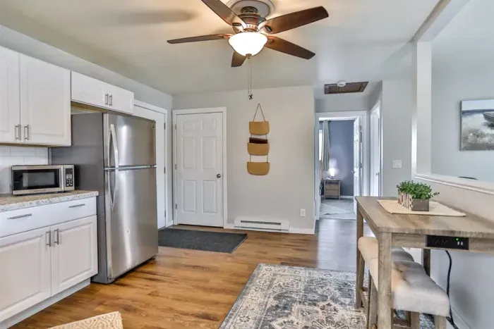Comfortable kitchen and dining space offering a practical cooking area, tasteful finishes, and room to gather at the table.