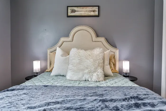 Well-appointed bedroom space offering a relaxed layout, tasteful décor, and convenient closet storage for everyday living.