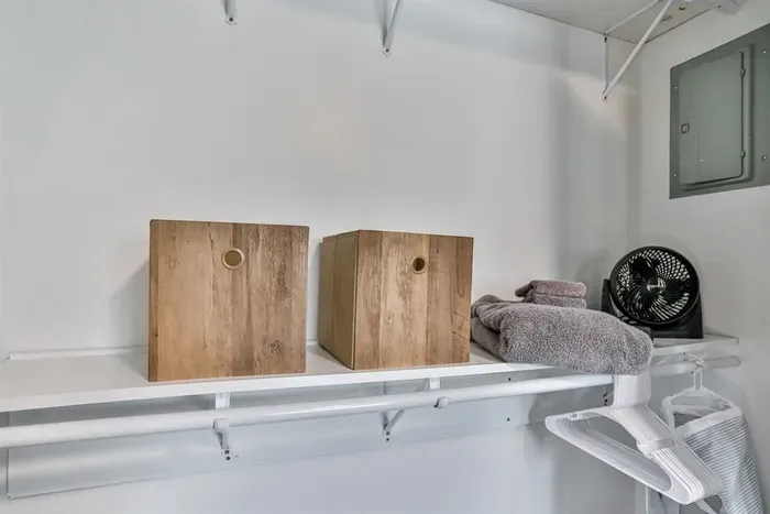 Practical closet storage with shelving, hanging space, and room for linens, accessories, and everyday essentials.
