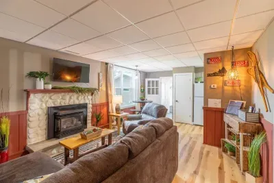 Indulge in comfort and style in our living room, featuring plush sofas, and elegant chairs. Cozy up by the fireplace, and unwind with entertainment on the TV.