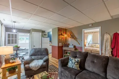 Indulge in comfort and style in our living room, featuring plush sofas, and elegant chairs. Cozy up in the living room and unwind with entertainment on the TV.