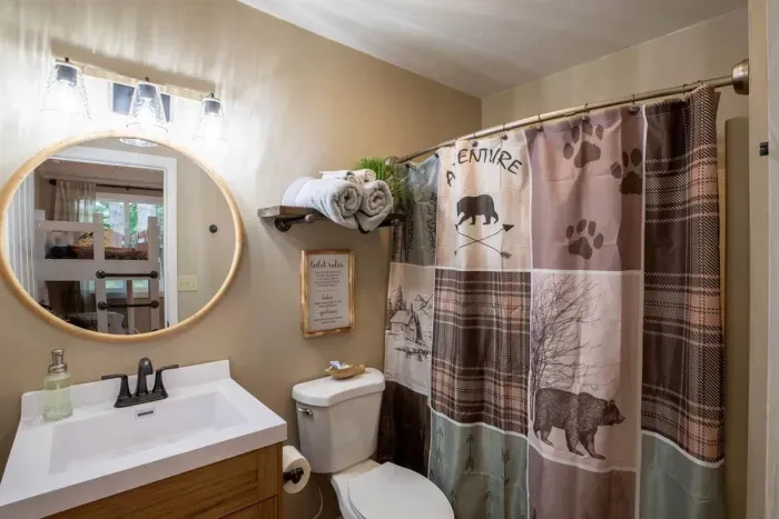 Experience modern convenience in our Airbnb with a pristine bathroom featuring a sleek toilet. Unwind in a clean and stylish space, ensuring a refreshing and comfortable stay throughout your visit.