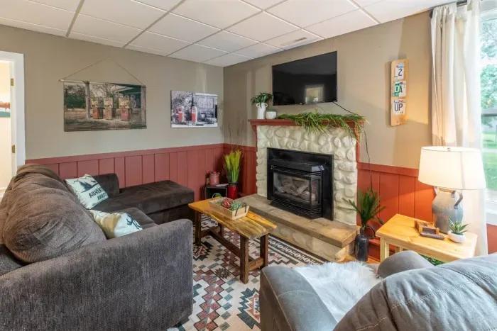 Indulge in comfort and style in our living room, featuring plush sofas, and elegant chairs. Cozy up by the fireplace, and unwind with entertainment on the TV. 