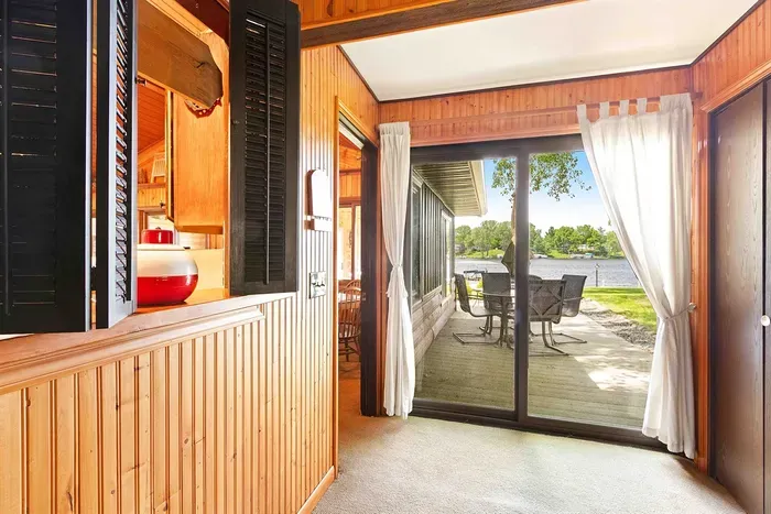 Step out onto the sun-drenched veranda, a cozy retreat with comfortable seating and a charming view, perfect for morning coffee or evening drinks.