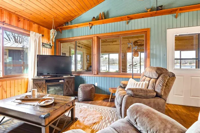 Chic Wooden Accents & Cozy Couch in Bright Lounge