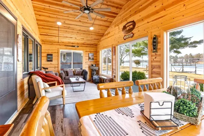 Inviting Sun Porch with Comfortable Seating & Table