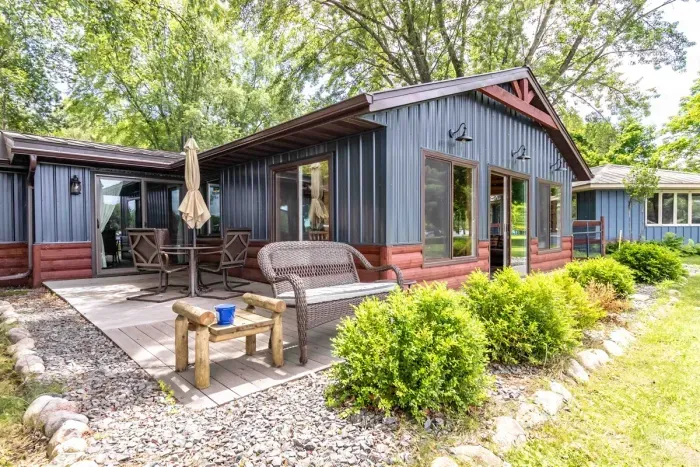 Charming Nekoosa cabin with large yard, lake access, and serene Wisconsin nature.