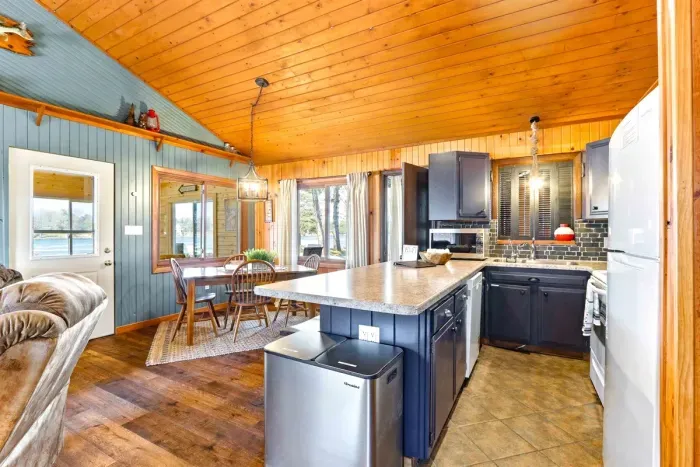 Bright Kitchen with Chic Blue Cabinets & Breakfast Bar