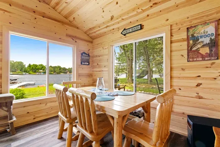 A sun-filled porch bathed in natural light, perfect for relaxing with a book or enjoying morning coffee while soaking in the surrounding views.