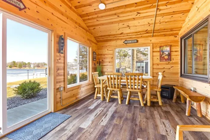 Relaxing Sunroom with Plush Couch & Elegant Wooden Details