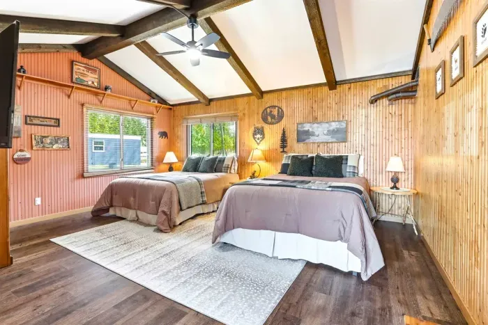 Spacious retreat featuring two queen beds, warm wood décor, and a bright, relaxing atmosphere for your Wisconsin getaway.