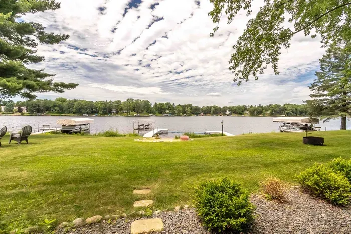 Spacious waterfront property in Nekoosa, WI with cabins and scenic nature views.