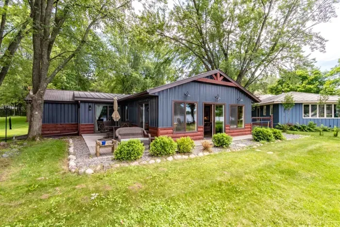 Charming Nekoosa cabin with large yard, lake access, and serene Wisconsin nature.