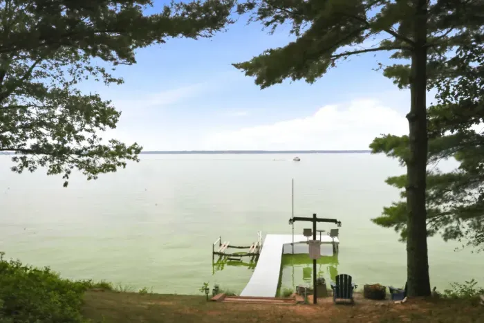 Take in breathtaking, open-water views framed by towering trees from your private boat dock and lakeside Adirondack chairs, perfect for peaceful mornings and sunset watching.