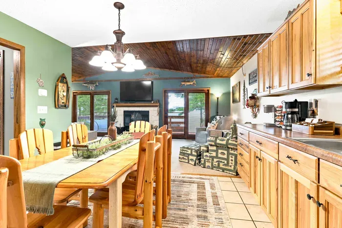 Experience the cozy, home-away-from-home charm of this fully stocked kitchen with its gas oven, dishwasher, and spacious dining table, perfectly designed for shared meals and relaxed mornings.