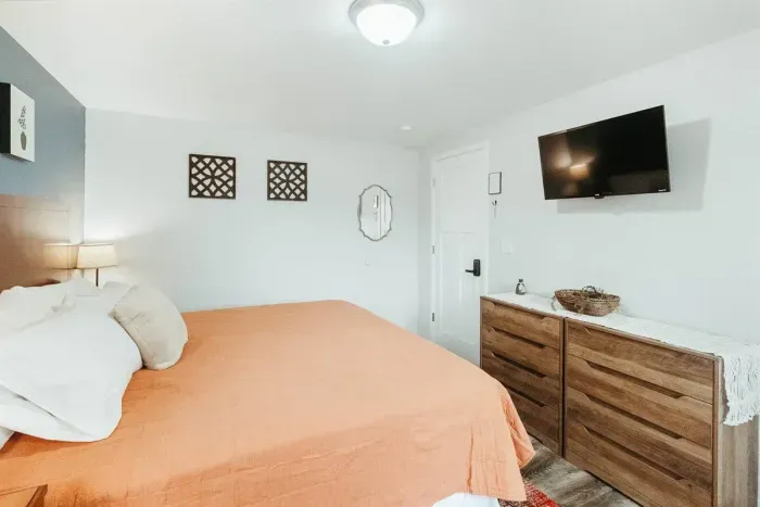 Your private sanctuary awaits – enjoy a restful night's sleep in our cozy bedroom.

Queen Bed
Soft Sofa
Television