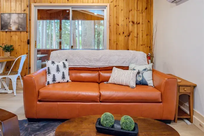 Indulge in comfort and style in our living room, featuring plush sofas, and elegant chairs. Cozy up by the fireplace, and unwind with entertainment on the TV.