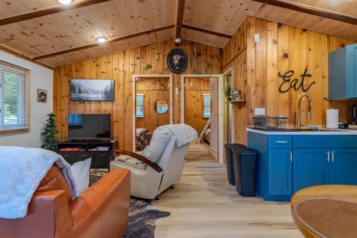 Indulge in comfort and style in our living room, featuring plush sofas, and elegant chairs. Cozy up by the fireplace, and unwind with entertainment on the TV.