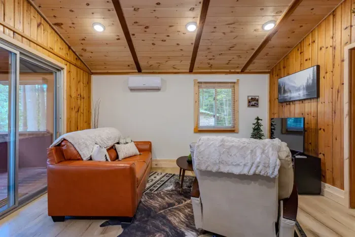 Indulge in comfort and style in our living room, featuring plush sofas, and elegant chairs. Cozy up by the fireplace, and unwind with entertainment on the TV.