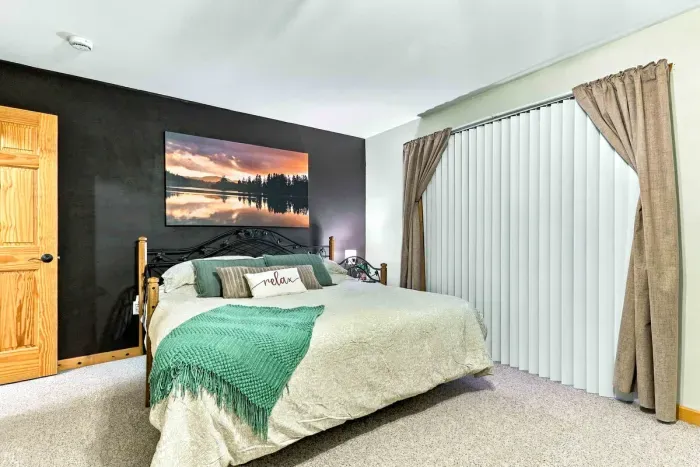 Restful, spacious, and steps from the outdoors! Featuring two plush beds, stylish decor, and direct sliding door access to the private deck.
