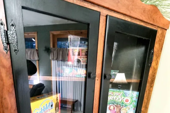 Designed with families in mind, this charming wooden cabinet keeps entertainment close at hand. Help yourself to a selection of popular board games and toys for quality time together.
