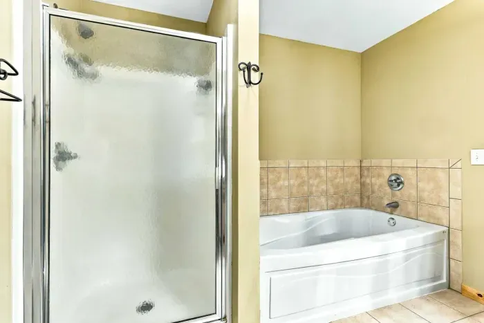 Refresh and unwind after a day of outdoor activities. This well-appointed bathroom offers the choice of a relaxing bath in the deep soaking tub or a quick rinse in the enclosed walk-in shower.