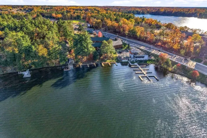 Park your boat right at your doorstep! Nestled along a tranquil shoreline framed by golden fall trees, the lodge offers multiple boat slips, lakeside docks, and unbeatable access to open water adventures.