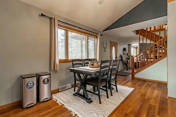 Modern and efficient—everything you need to create a delicious meal. The kitchen features a stainless steel refrigerator, stove, coffee maker, kitchenette oven, kettle, and blender