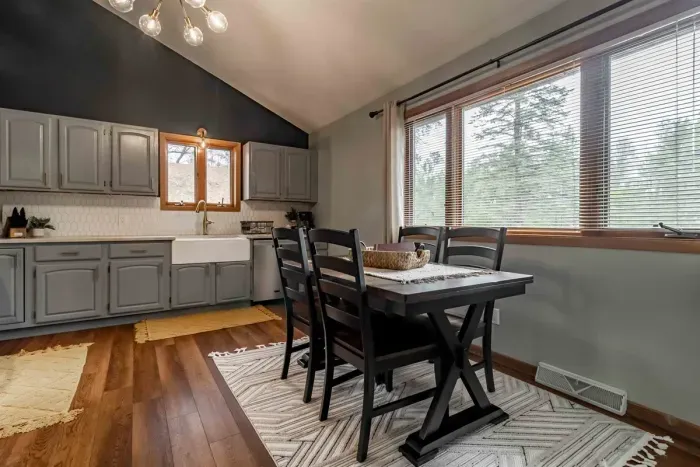 Modern and efficient—everything you need to create a delicious meal. The kitchen features a stainless steel refrigerator, stove, coffee maker, kitchenette oven, kettle, and blender